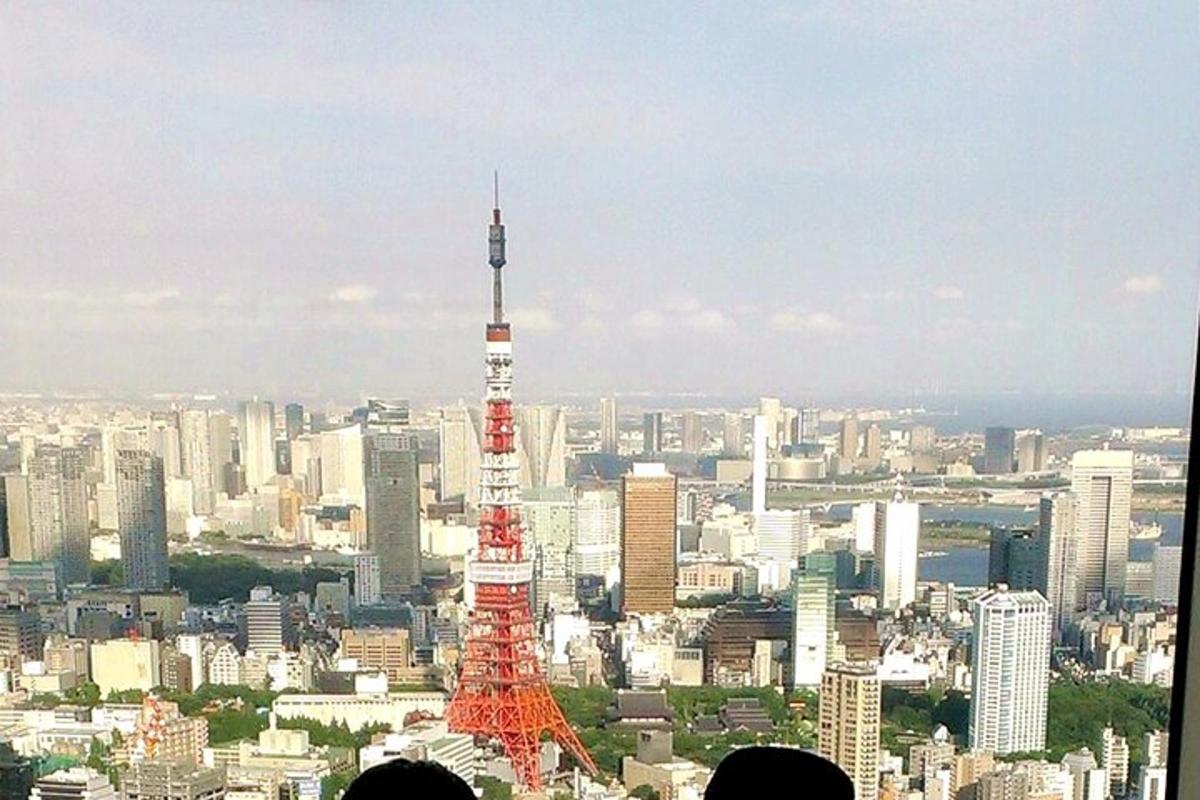 a view of a city with a red and white tower