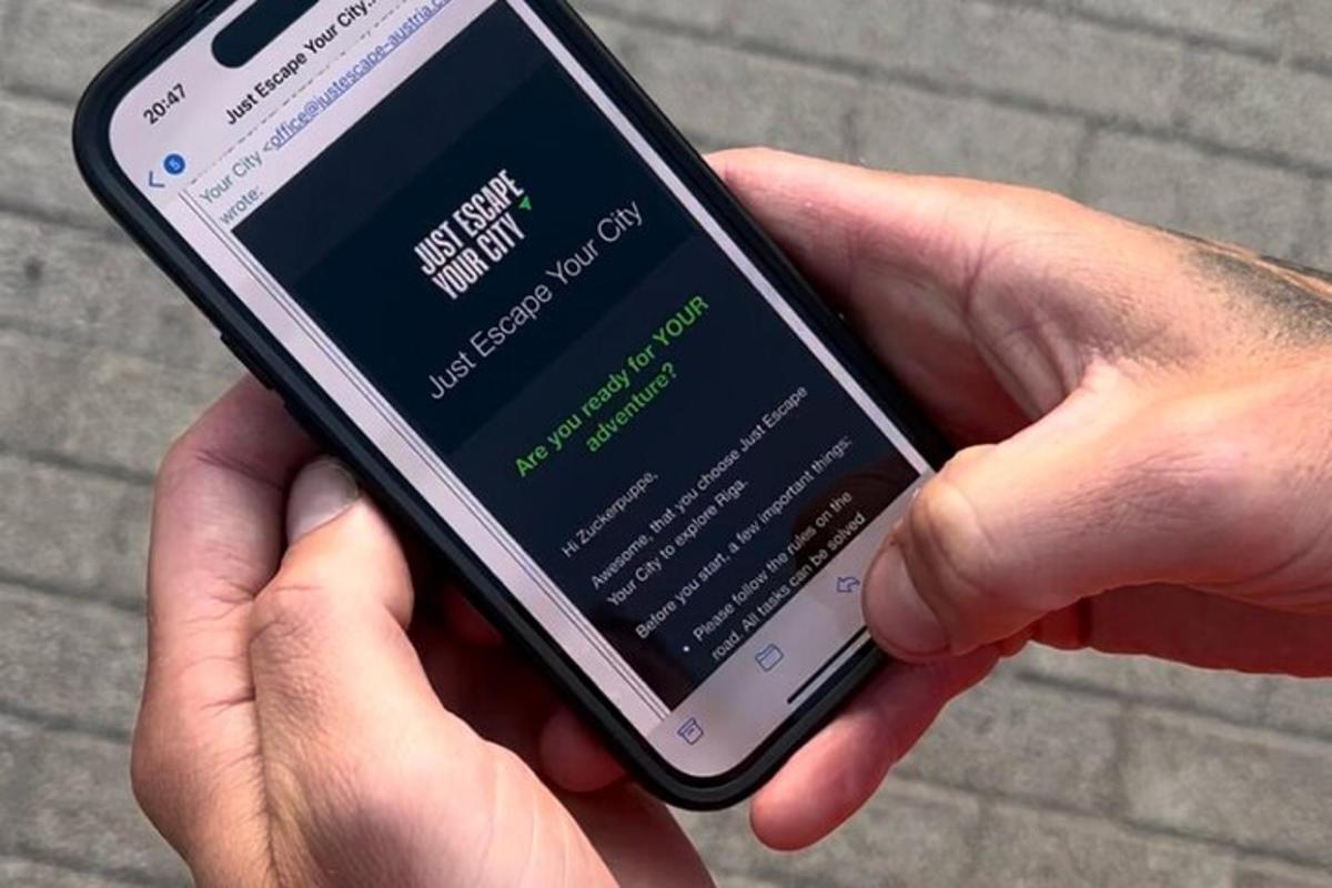 a person holding a cell phone in their hand