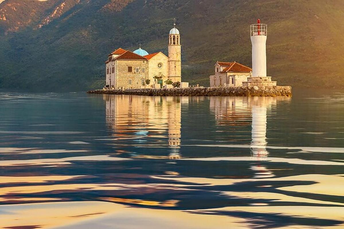 an island with two lighthouses in the water