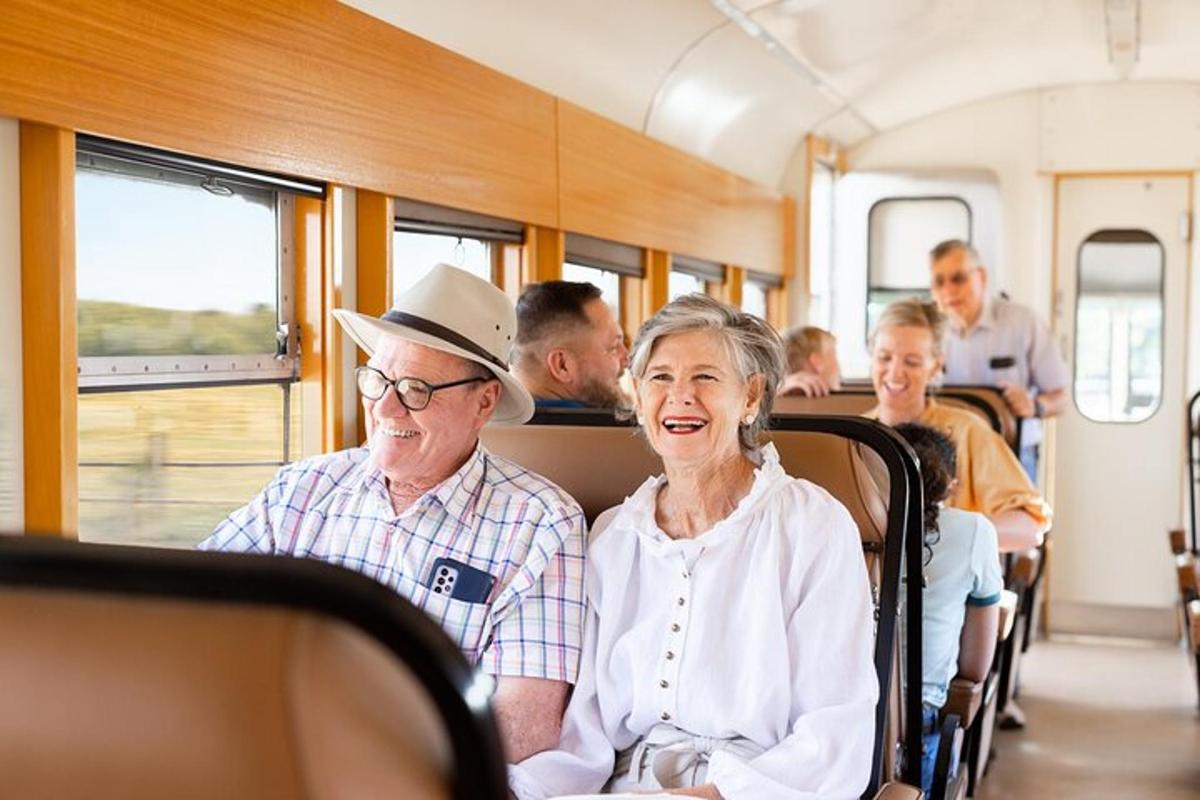 a group of people sitting on a train