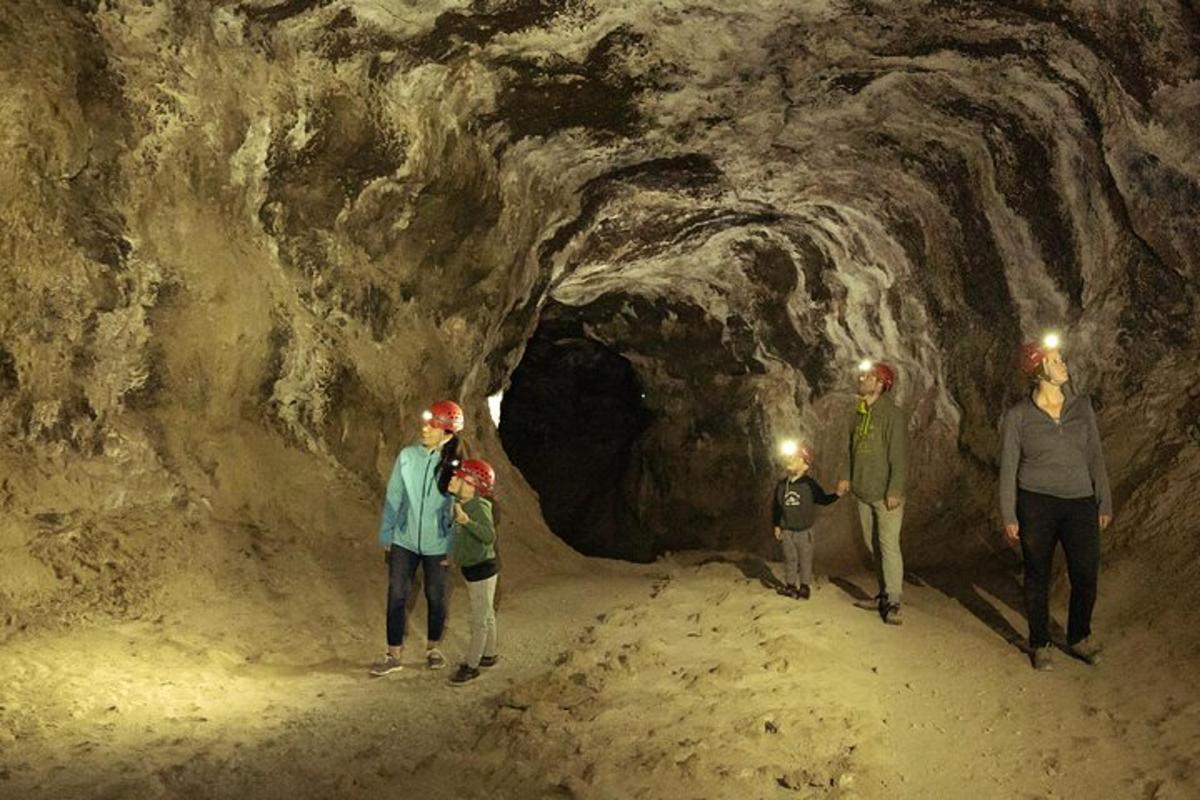 a group of people standing in a cave