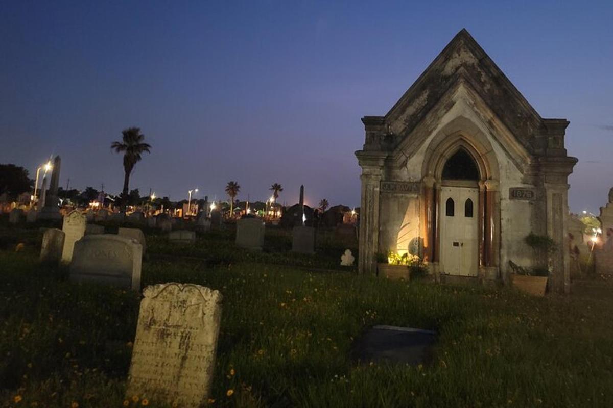 an old church in a cemetery at night