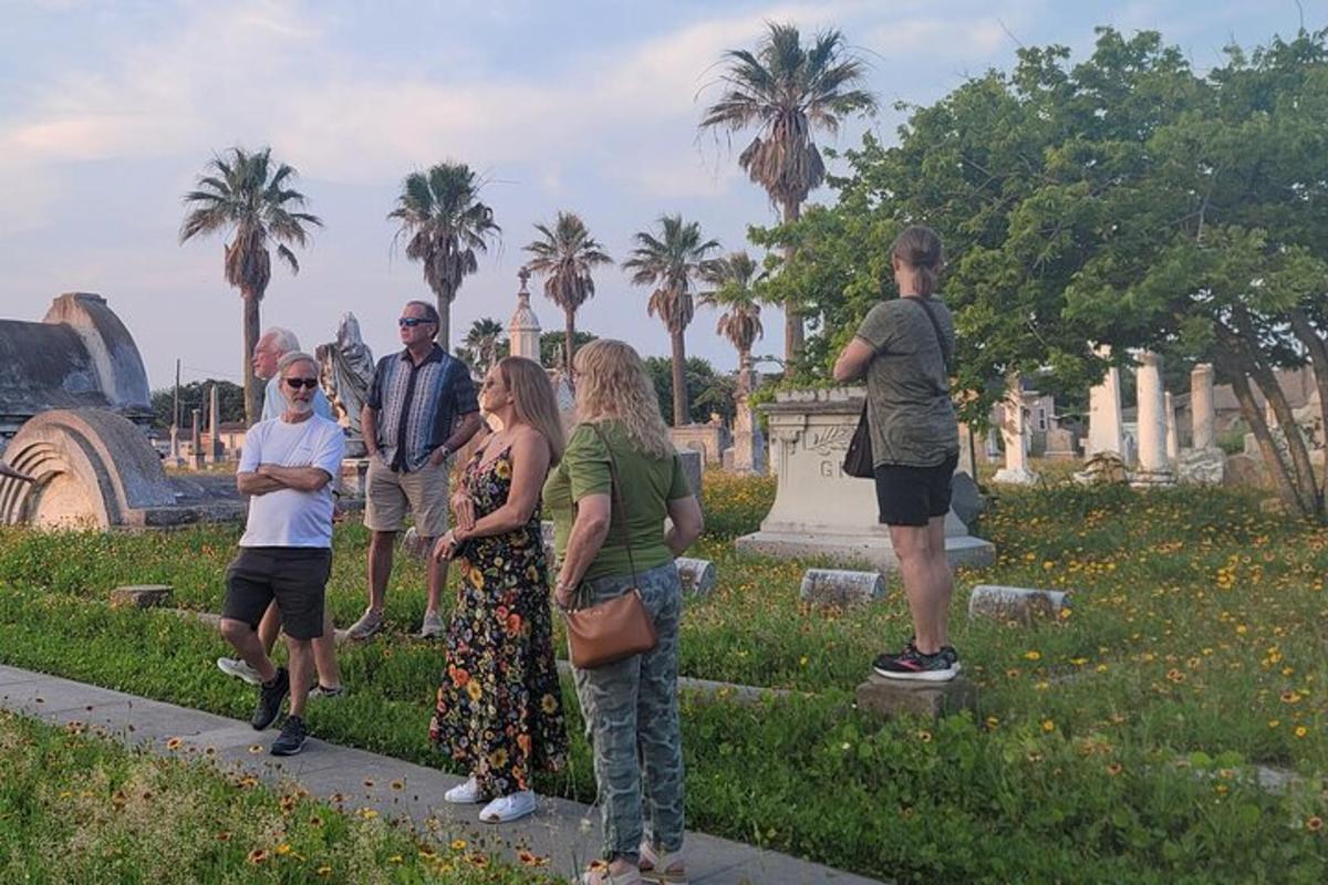 a group of people standing around in a park