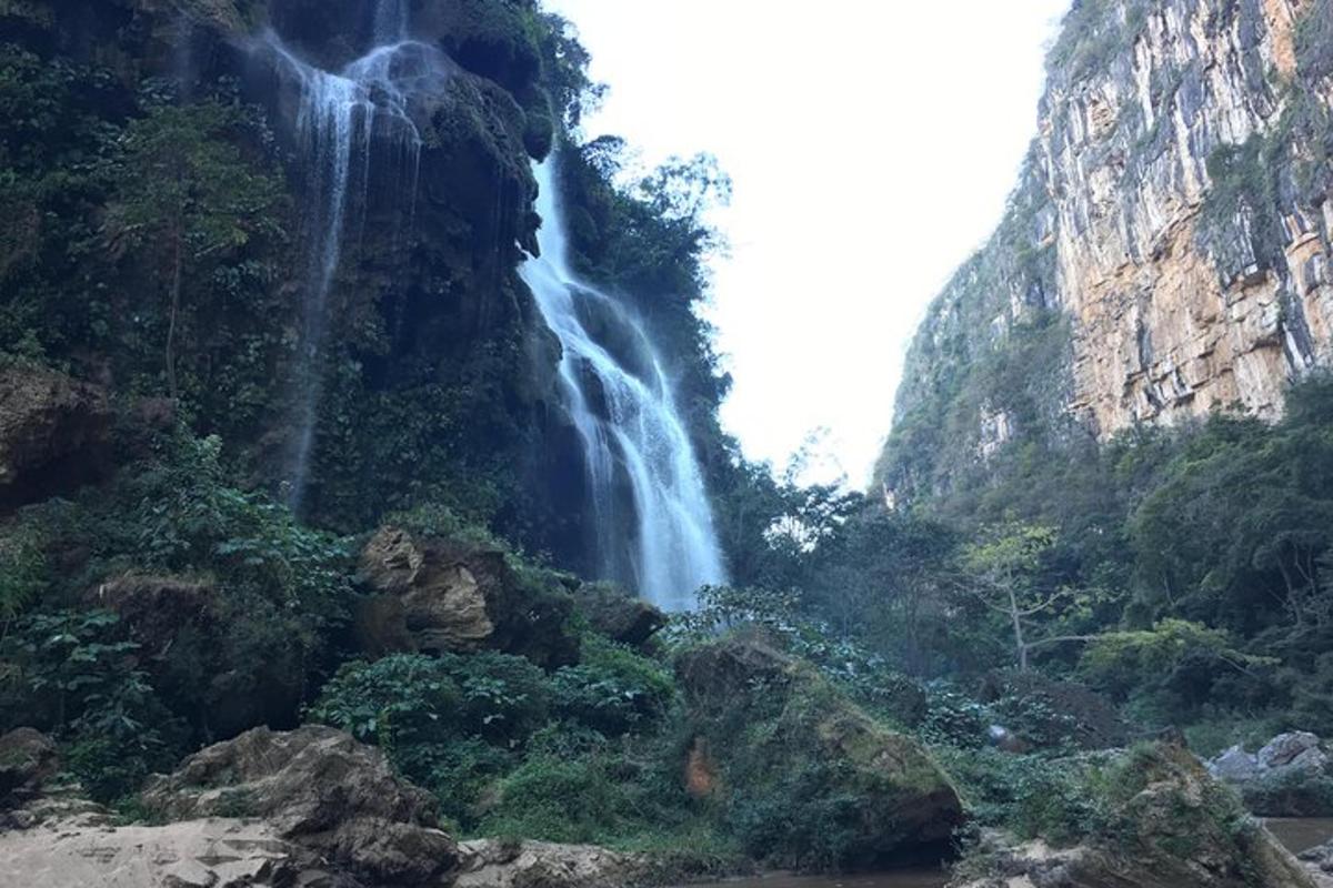 a waterfall on the side of a mountain