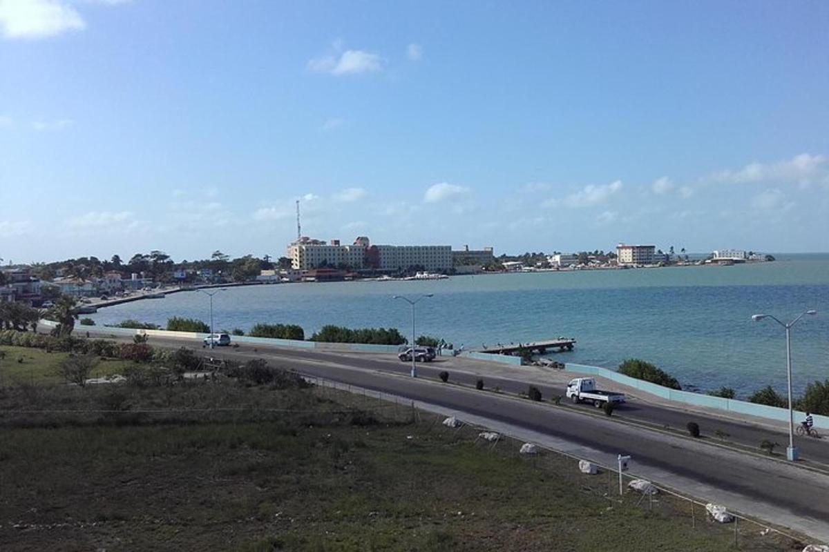 a highway with cars on it next to the water