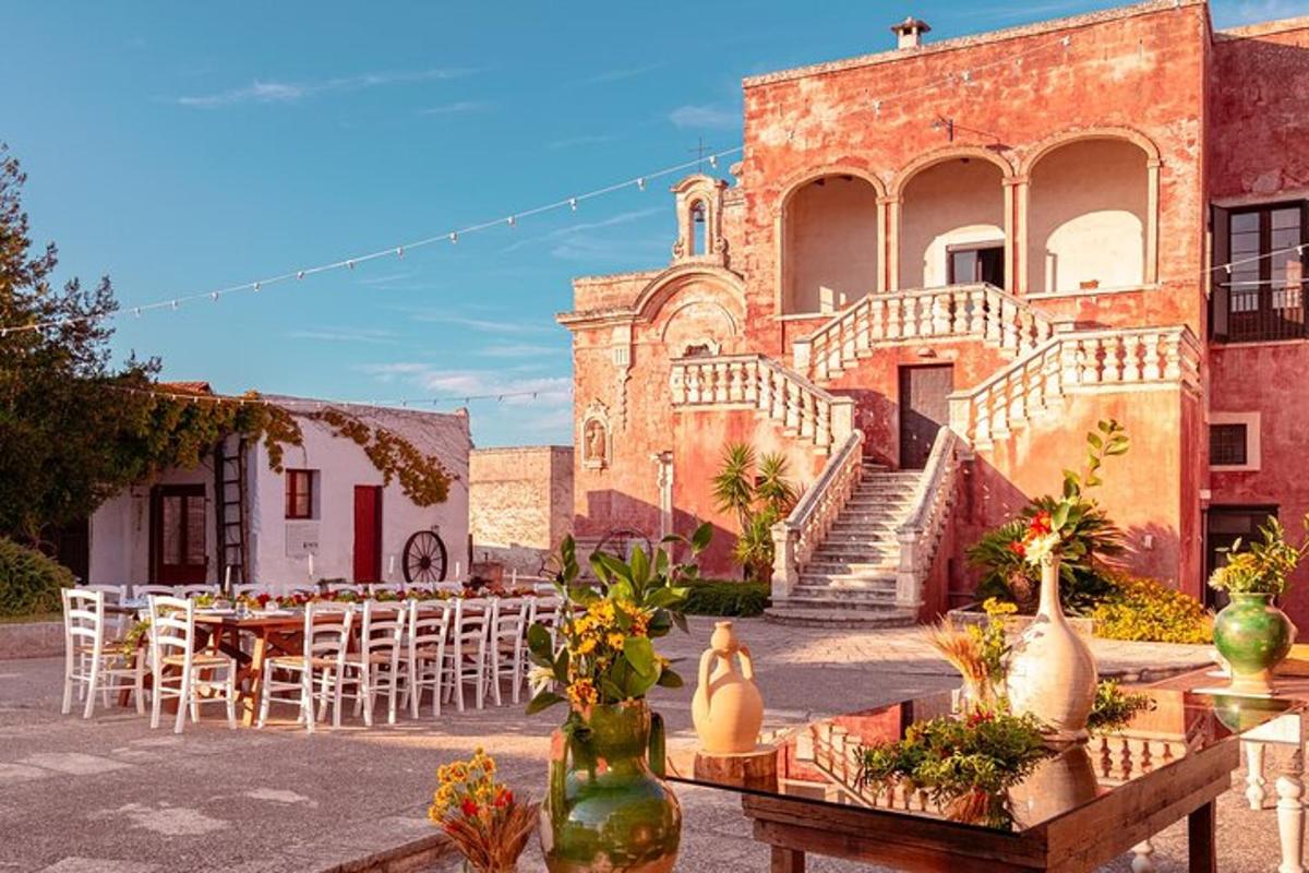a courtyard with tables and chairs and a building