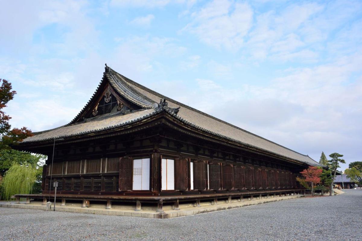 a large wooden building with a roof