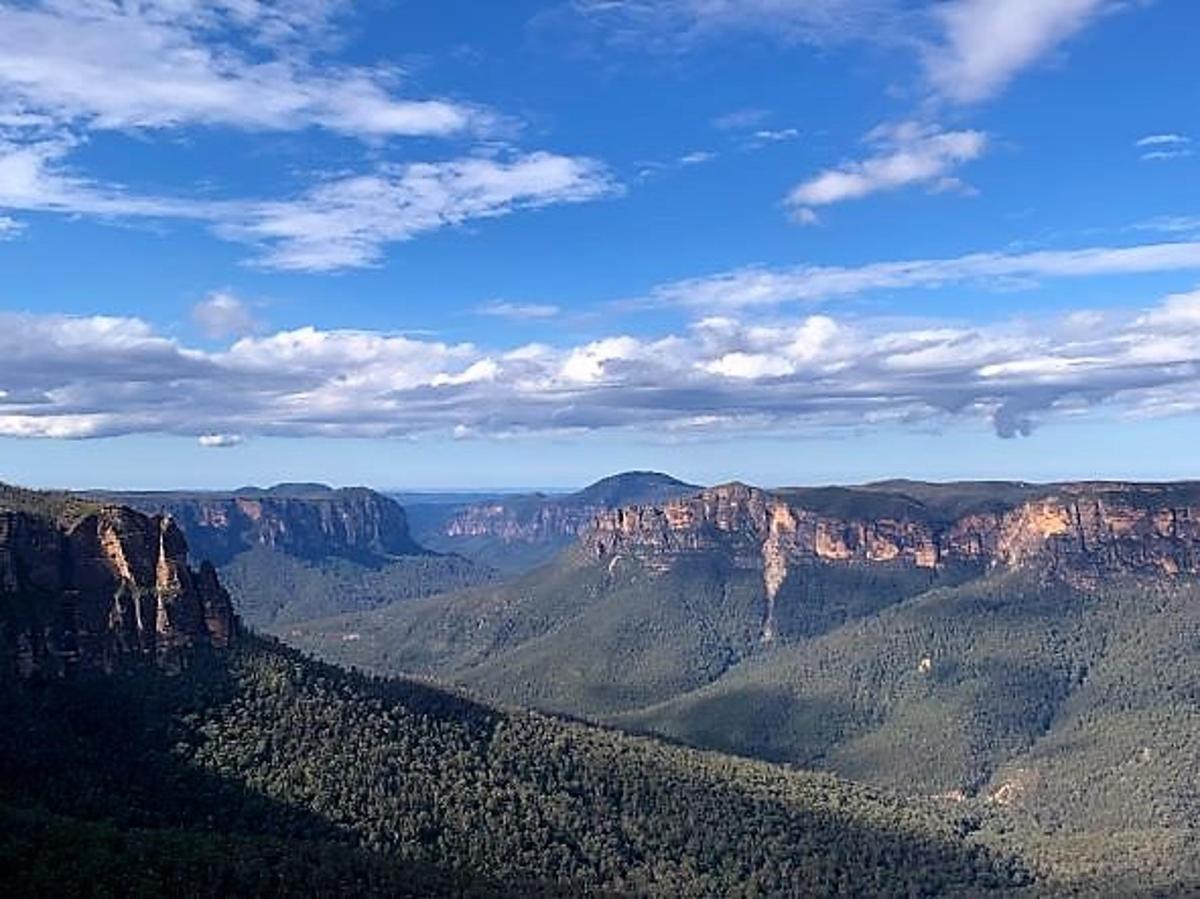 a view of the grand canyon under a blue sky