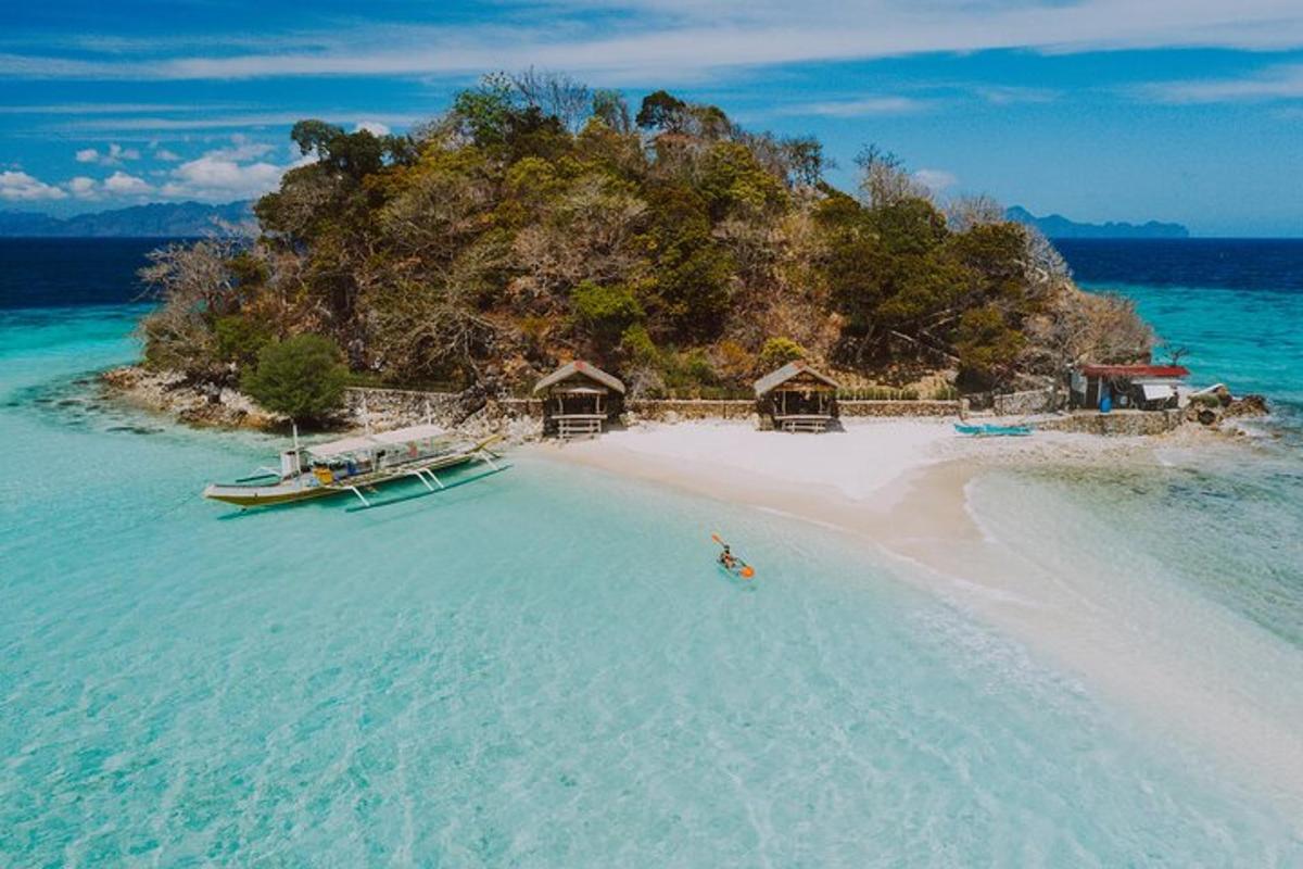 an island in the ocean with a boat in the water