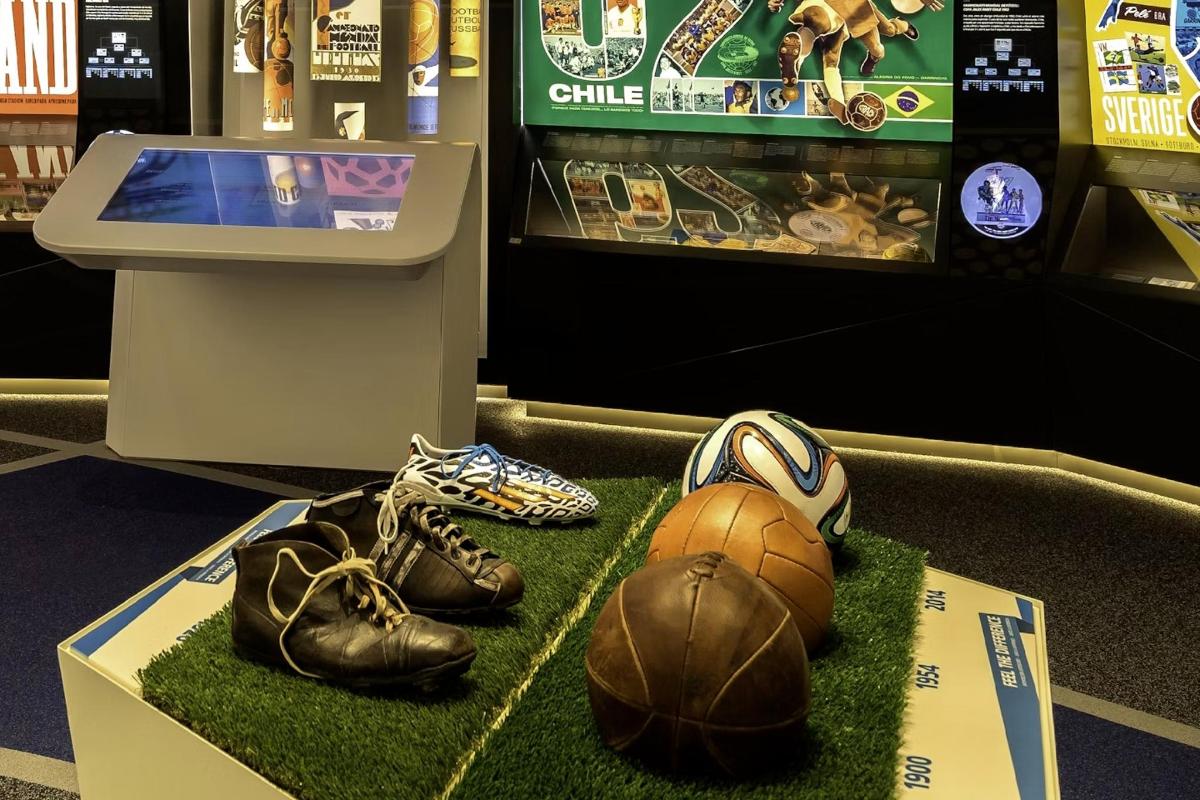 a display of shoes and basketballs on display in a store