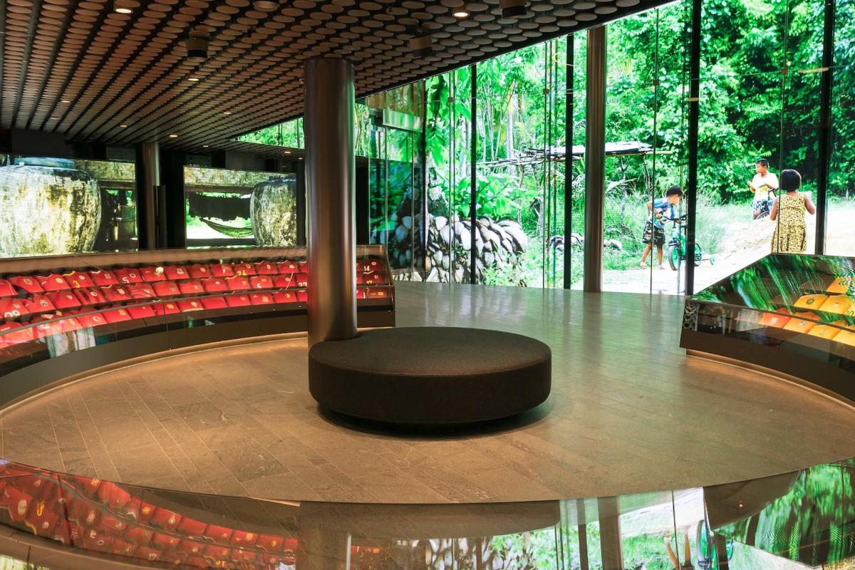a seat in the middle of a room with trees