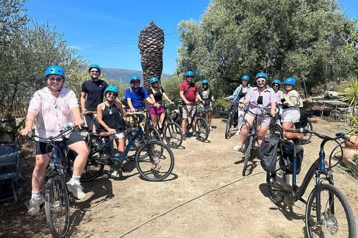 a group of people riding bikes on a dirt road