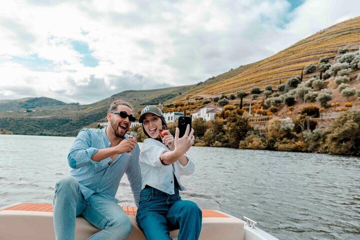 a man and a woman taking a picture on a boat