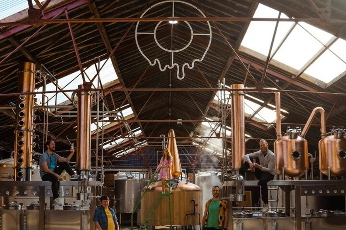 a group of people standing in a brewery