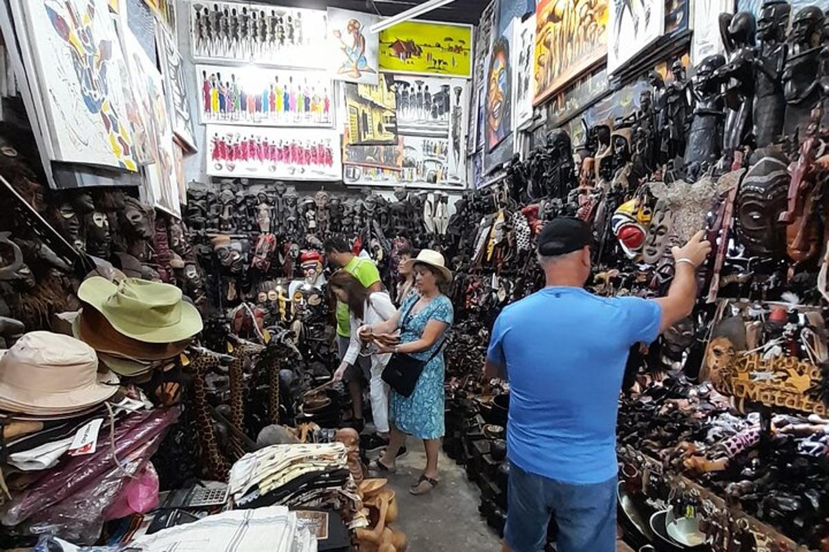 a group of people standing in a store looking at hats