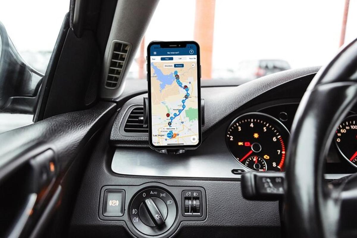 a cell phone sitting on the dashboard of a car