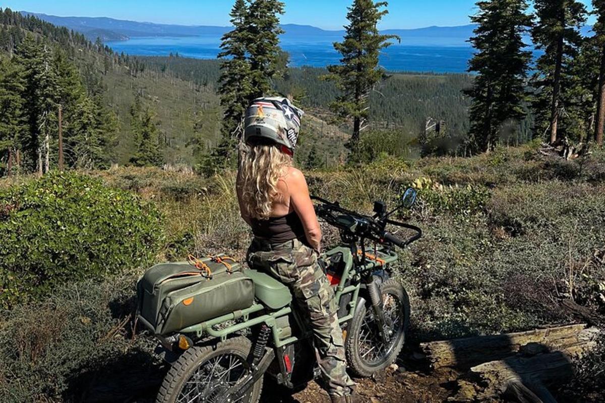 a woman is standing next to a motorcycle