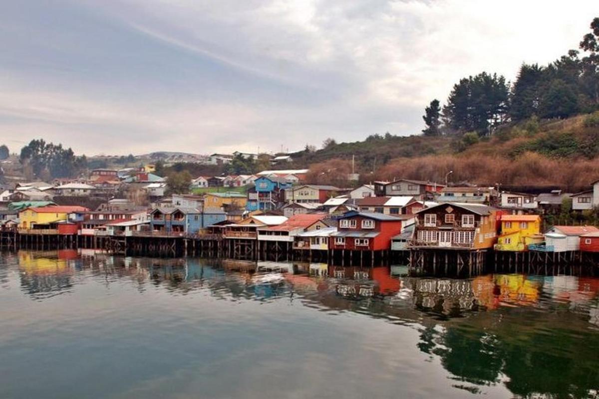 a group of houses sitting on the water