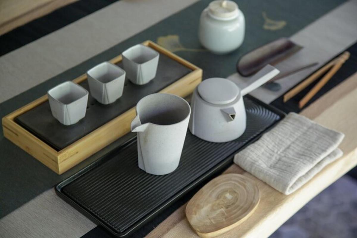 a table with a tray with cups and a knife