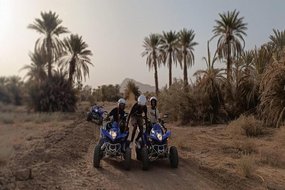 a group of people riding motorcycles on a dirt road