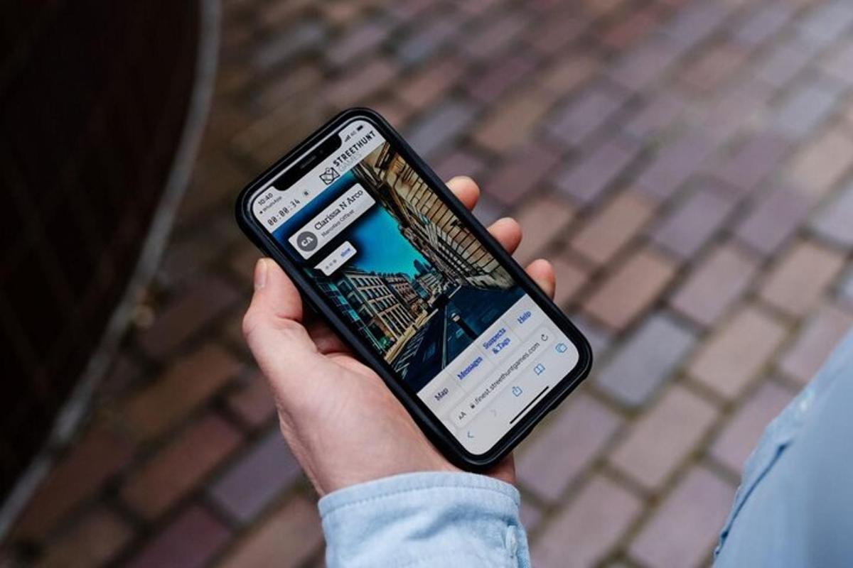 a person holding a cell phone in their hand