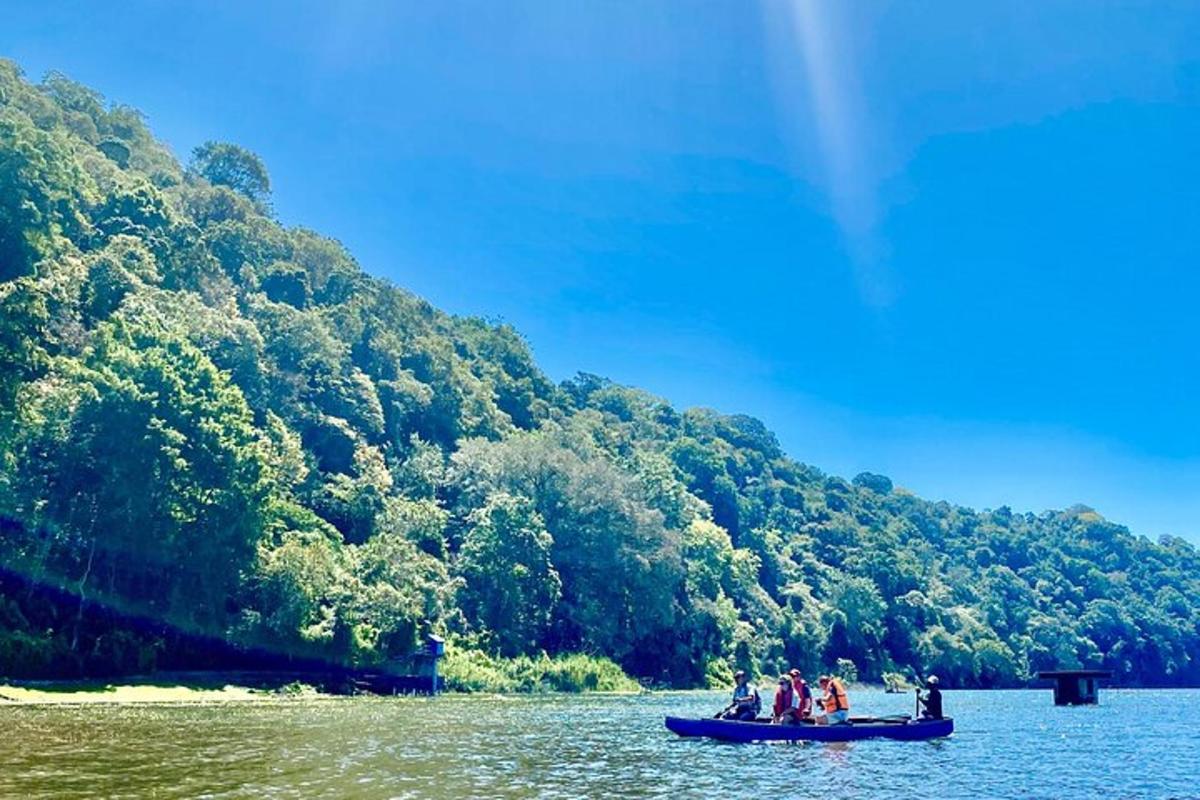 a group of people in a boat on a river