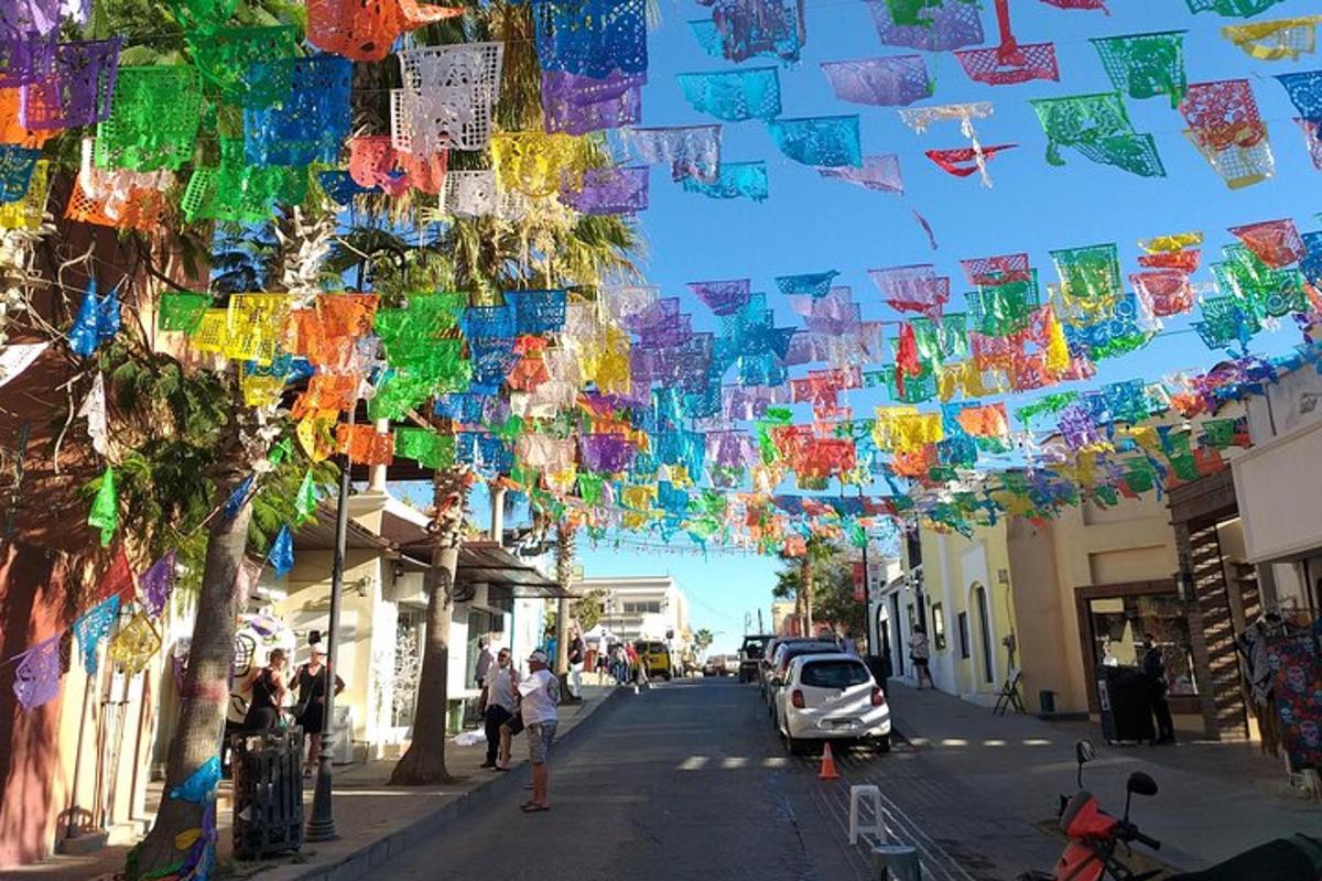 a street with a bunch of flags hanging over a street