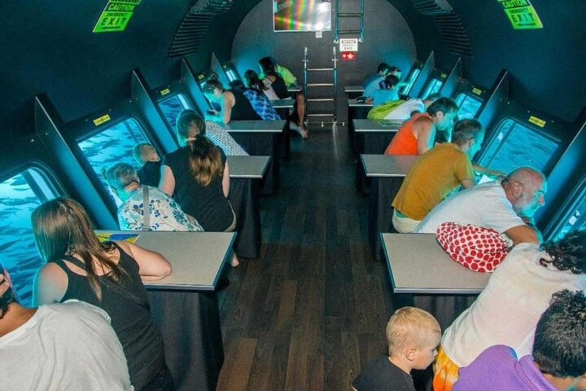 a group of people playing video games on a train