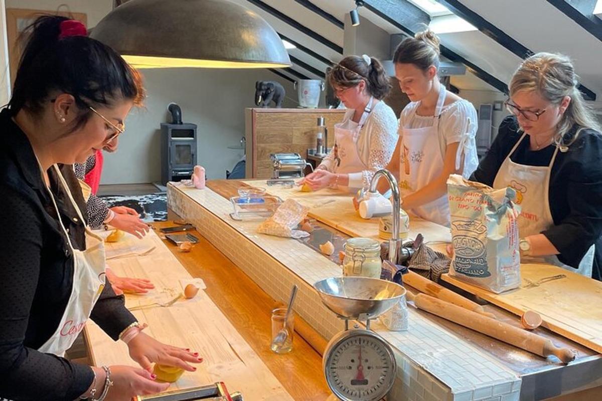 a group of women in a kitchen preparing food