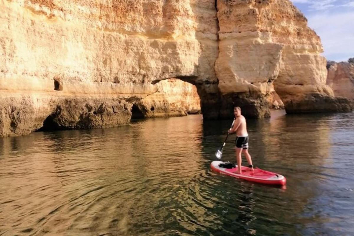 a man on a paddle board in the water