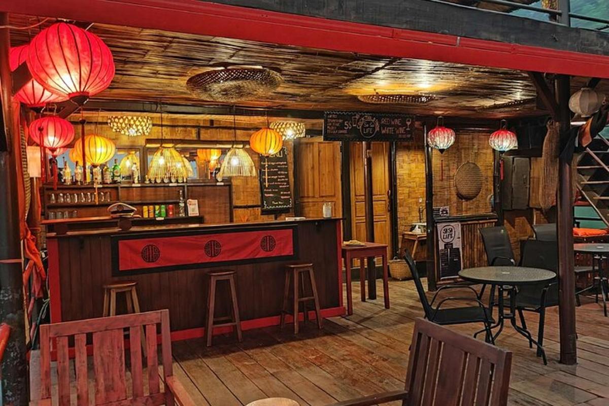 a bar in a restaurant with tables and chairs