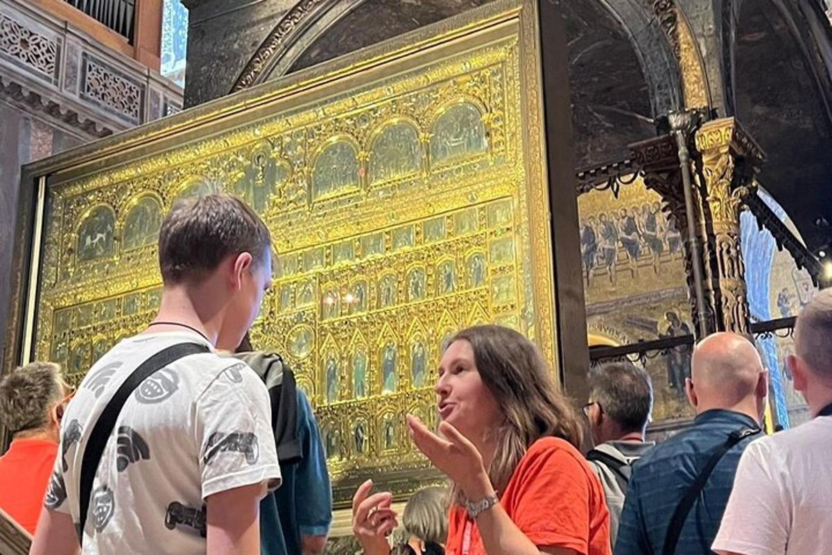 a group of people standing in front of a painting