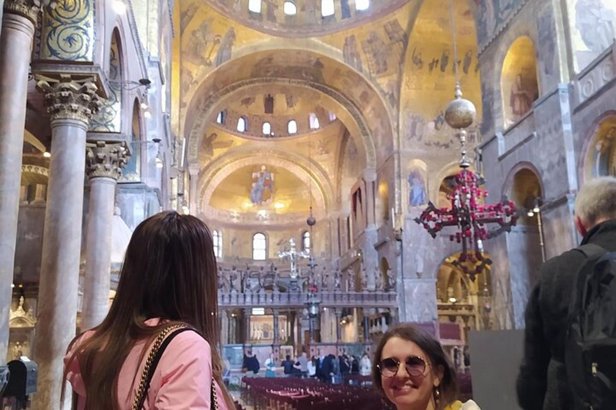 two people standing in a large church with a building