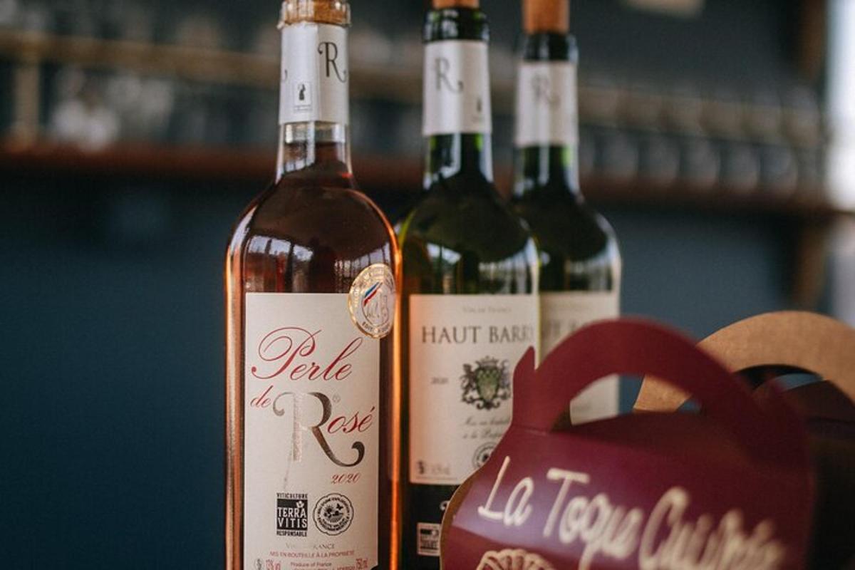 three bottles of wine sitting on a table with a heart