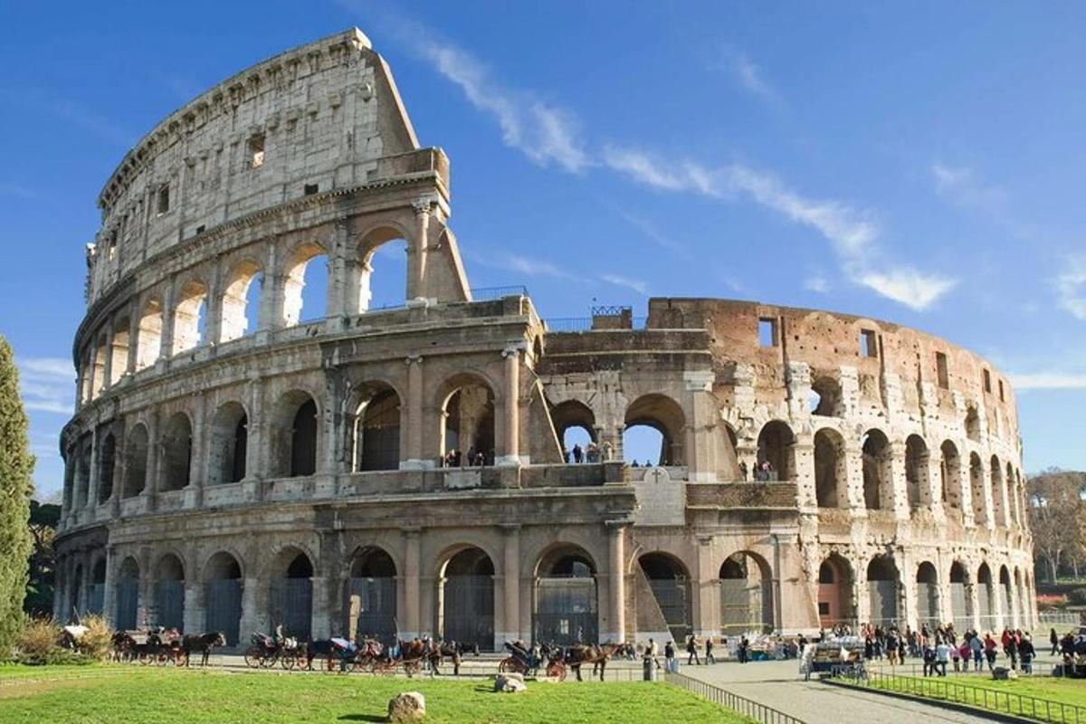 a building with people in front of the coliseum