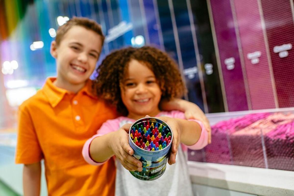a boy and girl holding a bowl of sprinkles