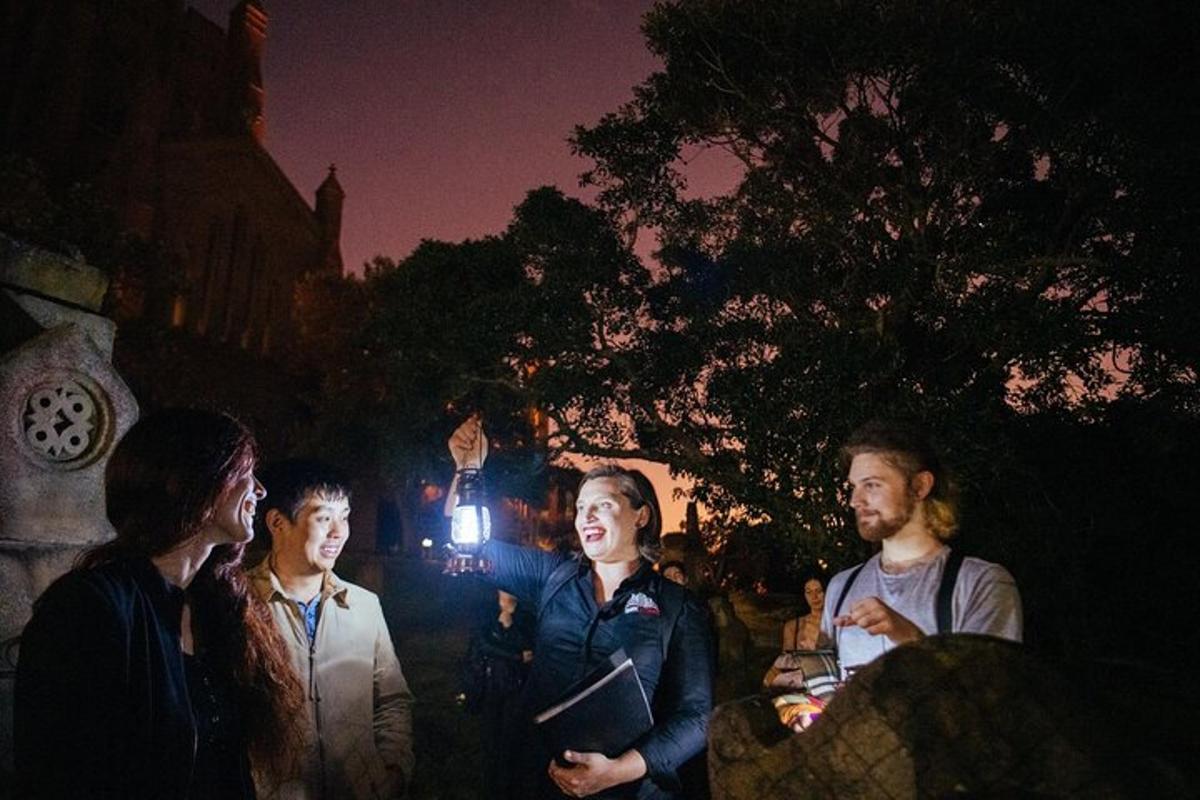 a group of people standing around in the dark