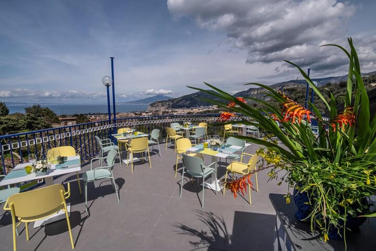 a restaurant with tables and chairs on a balcony