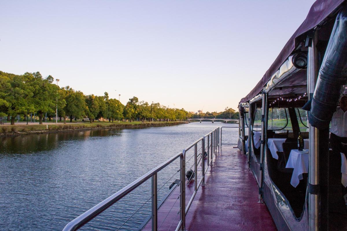 a boat is docked next to a river