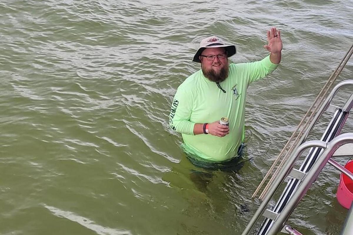 a man standing in the water in the water