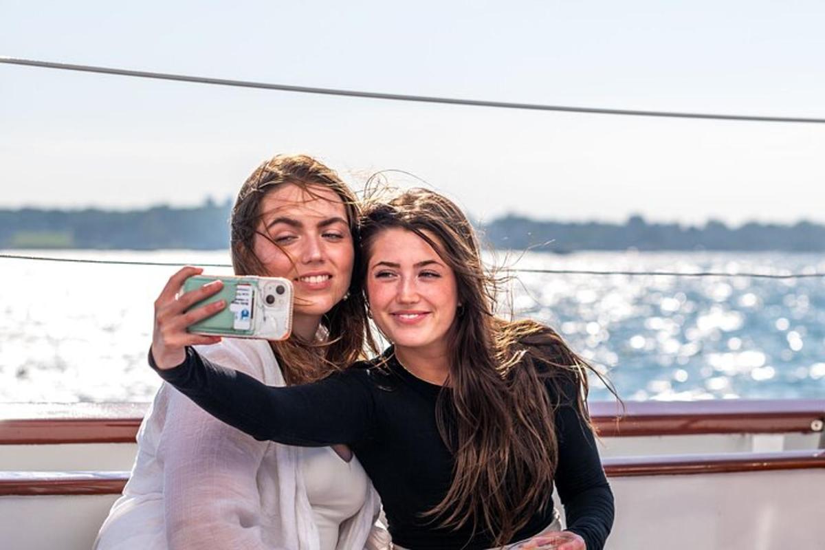 a man and a woman taking a picture on a boat
