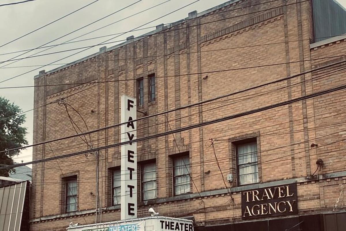 a large brick building with a hotelagency sign on it