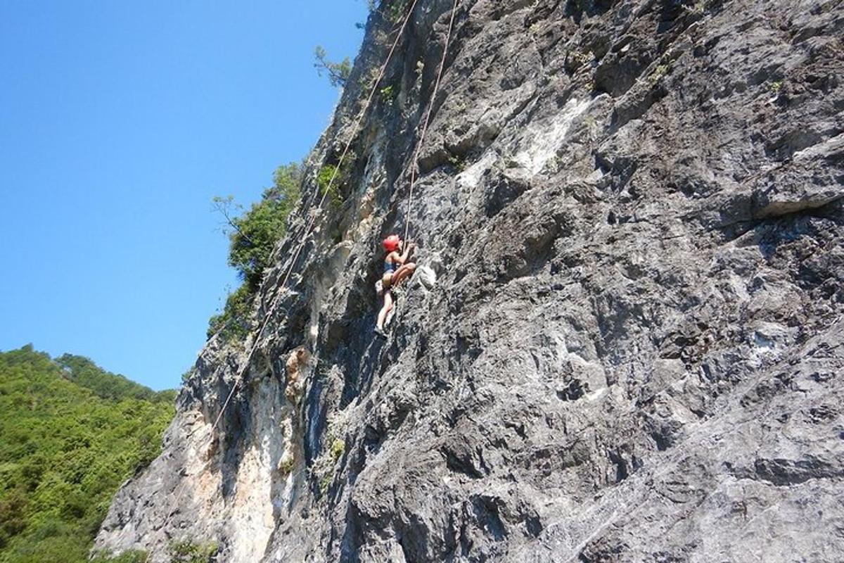a group of people climbing on a rocky mountain
