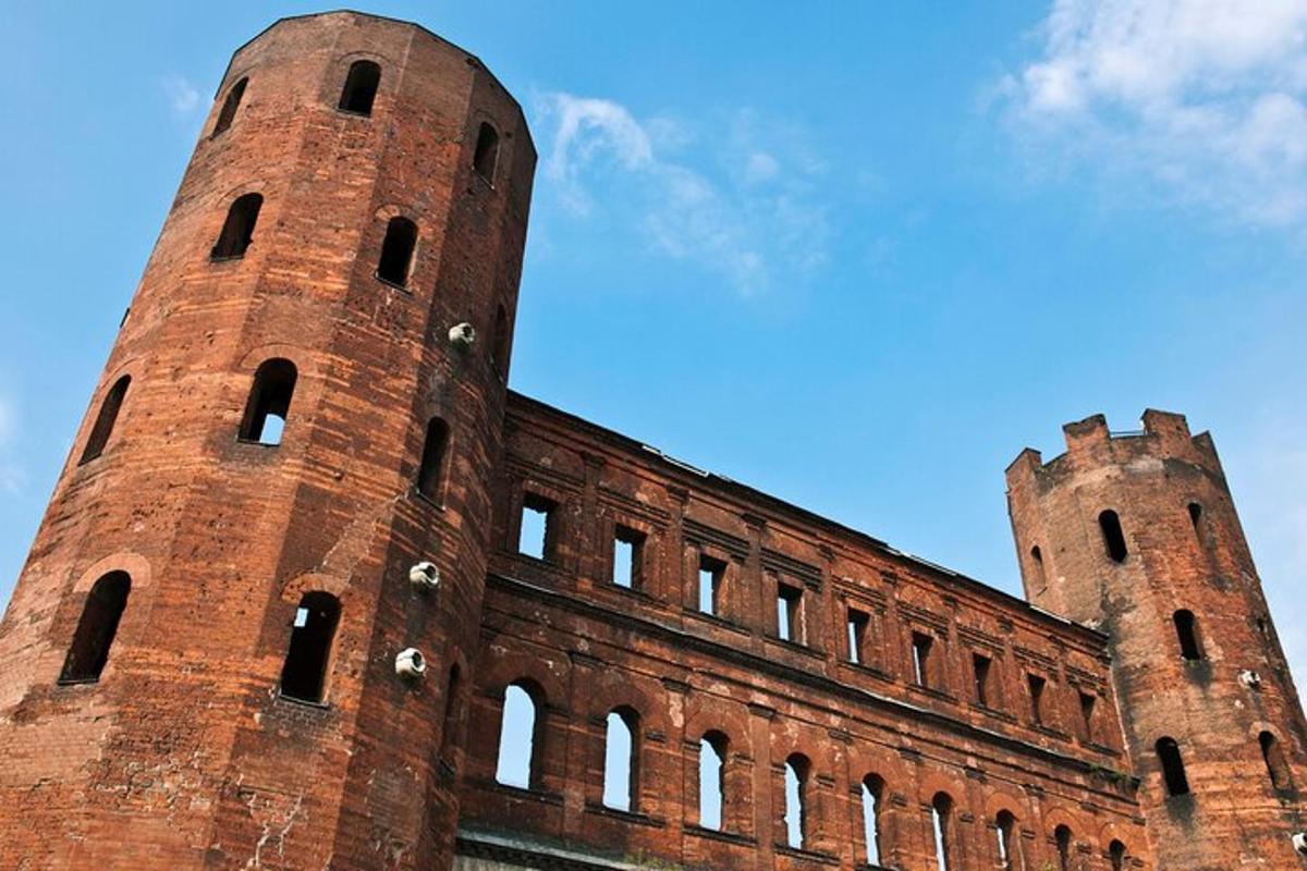 two tall brick towers on top of a building
