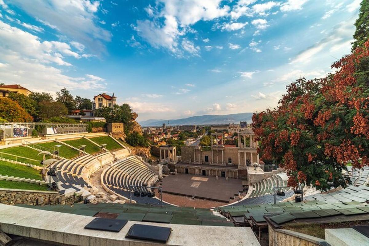 an amphitheater with a view of a city