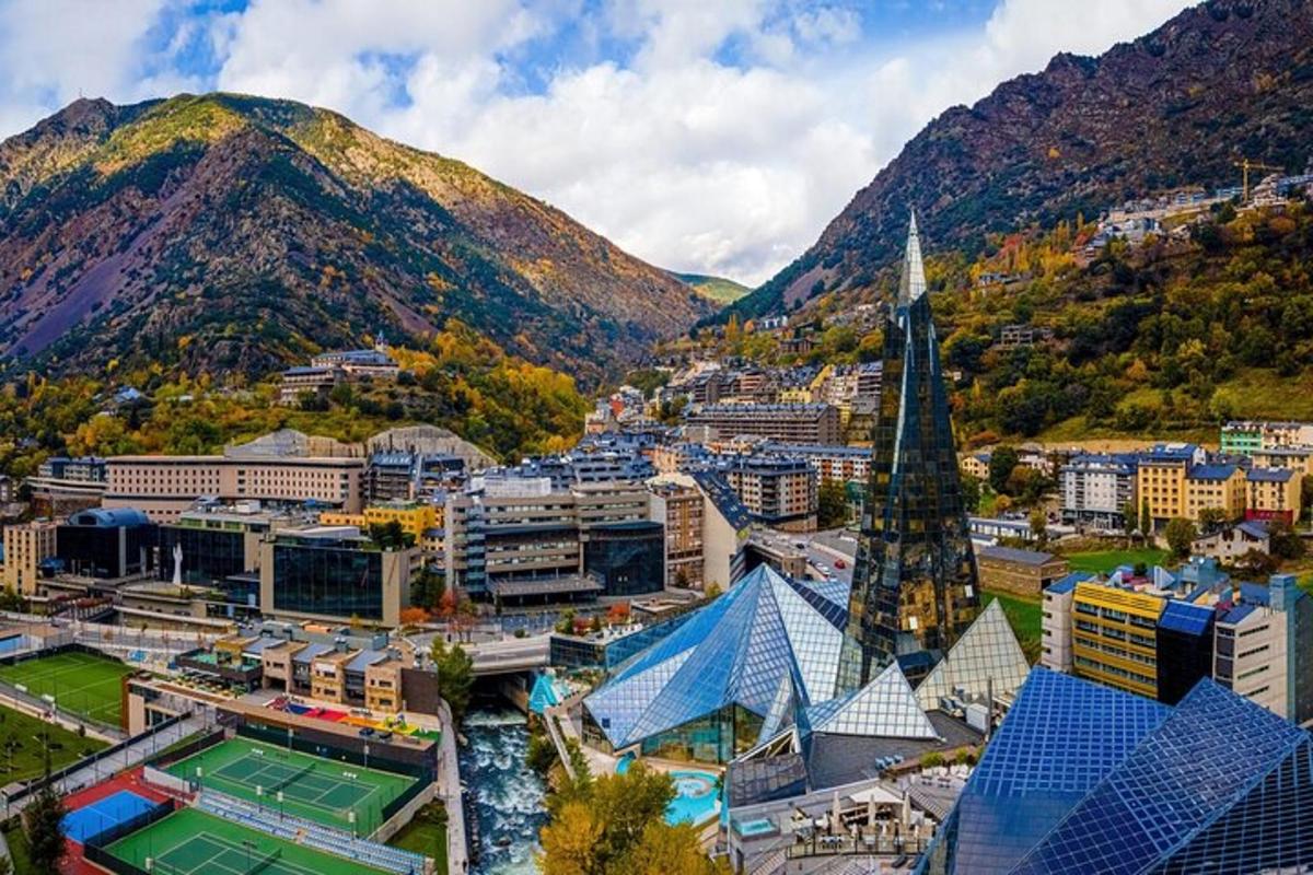 an aerial view of a city with a mountain
