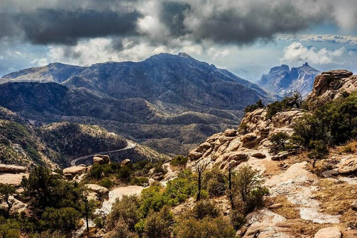 a view of a mountain range with mountains