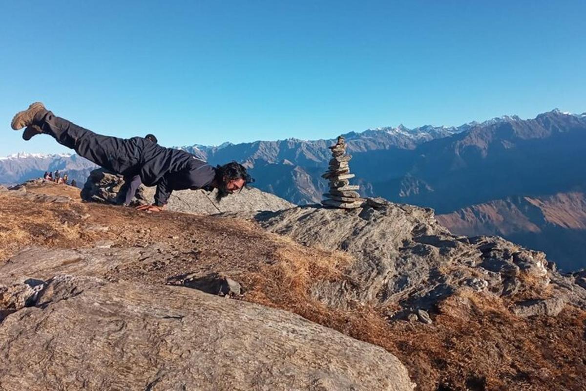 a person standing on the top of a mountain