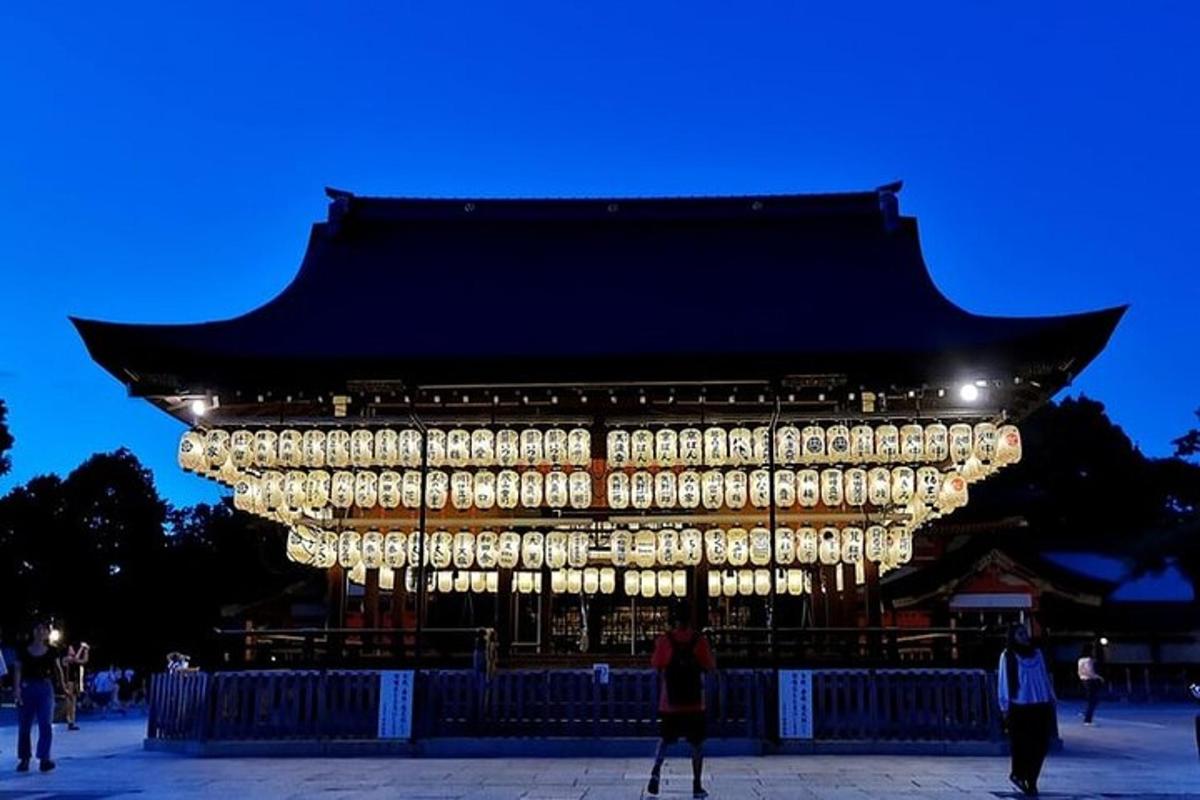 a large building with lights in front of it