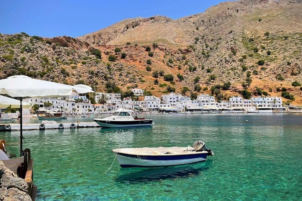 two boats are docked in a body of water